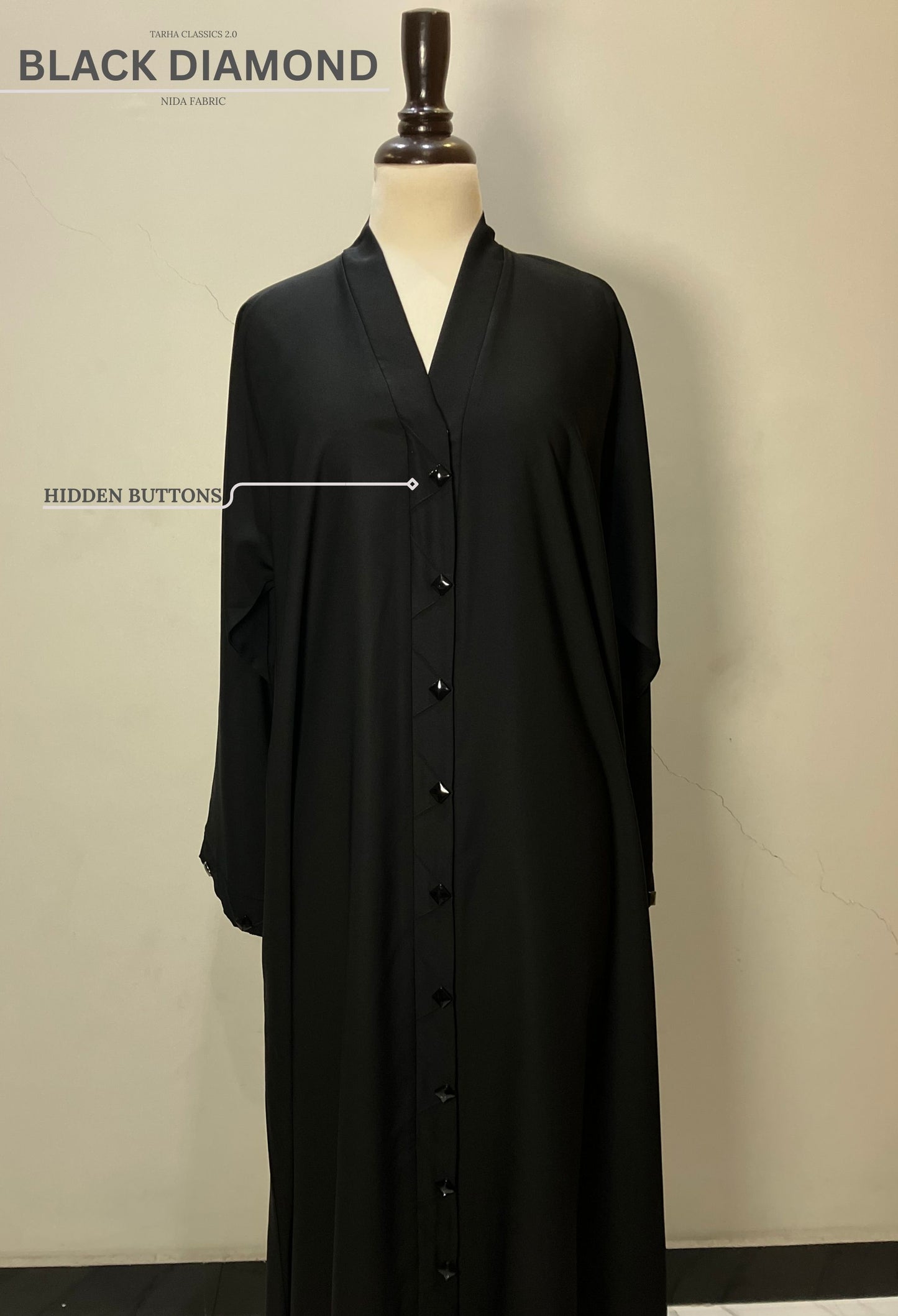 Front view of the Black Diamond abaya in Nida fabric highlighting the sleek hidden button closure.