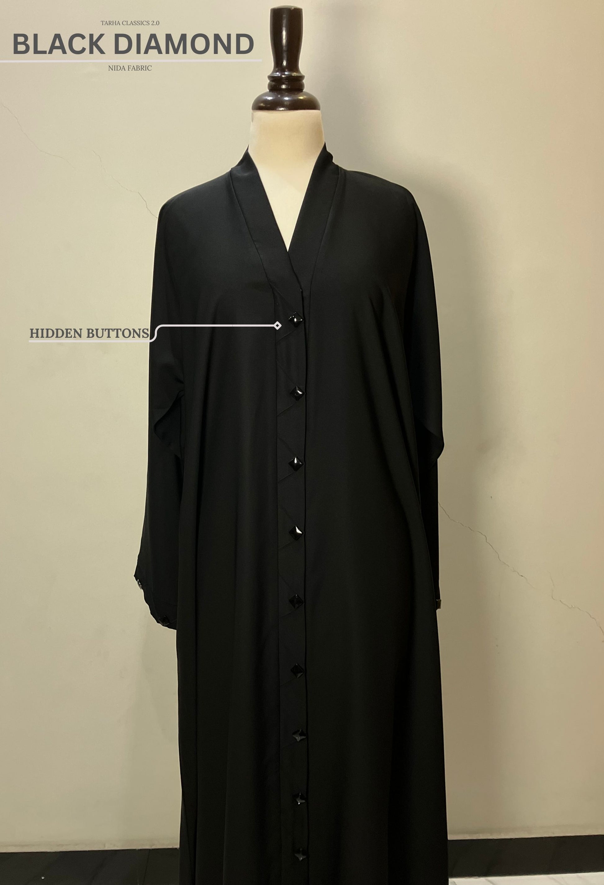 Front view of the Black Diamond abaya in Nida fabric highlighting the sleek hidden button closure.