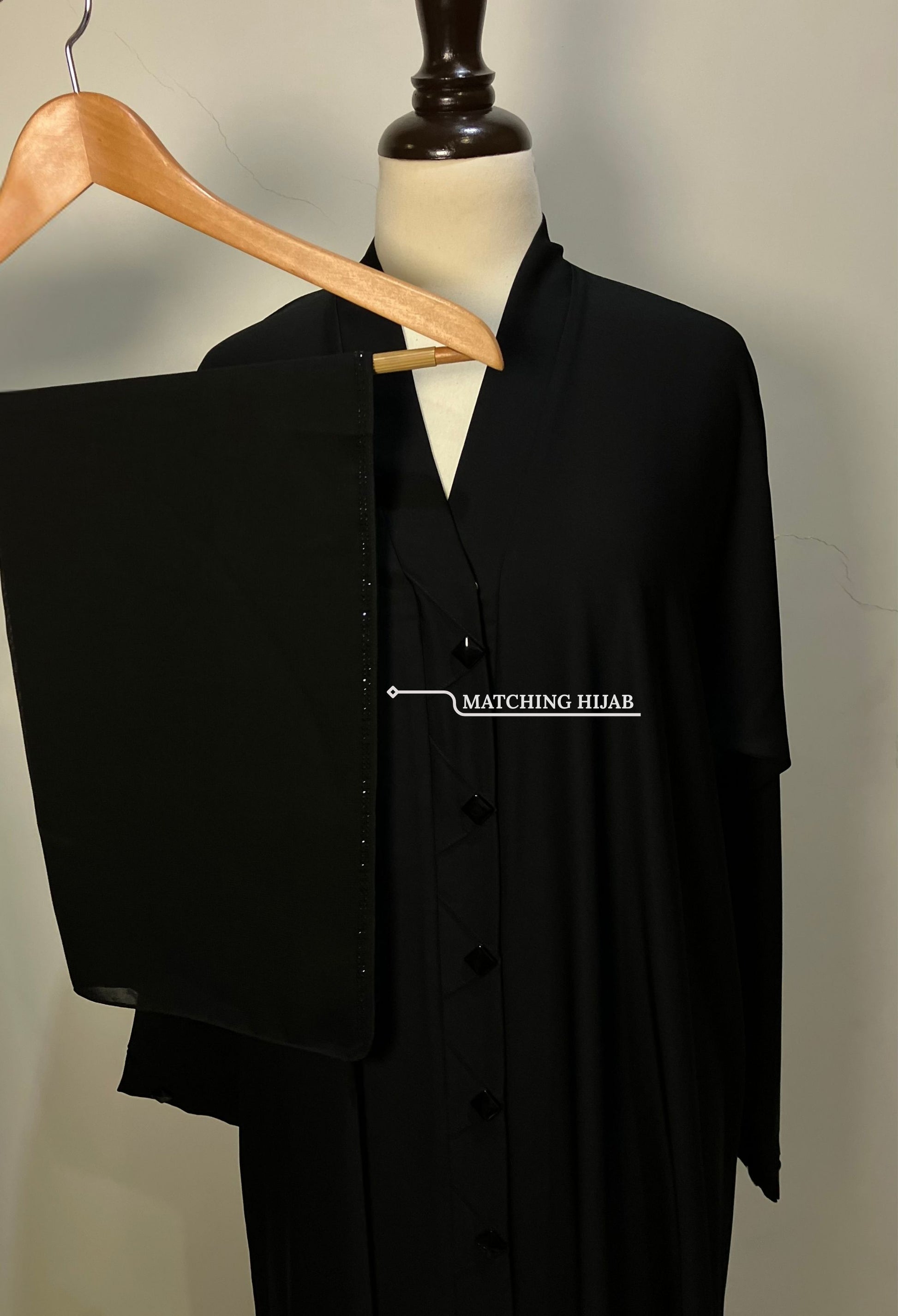 Black Diamond abaya set featuring a free matching black hijab with delicate border detailing – Tarha.pk.