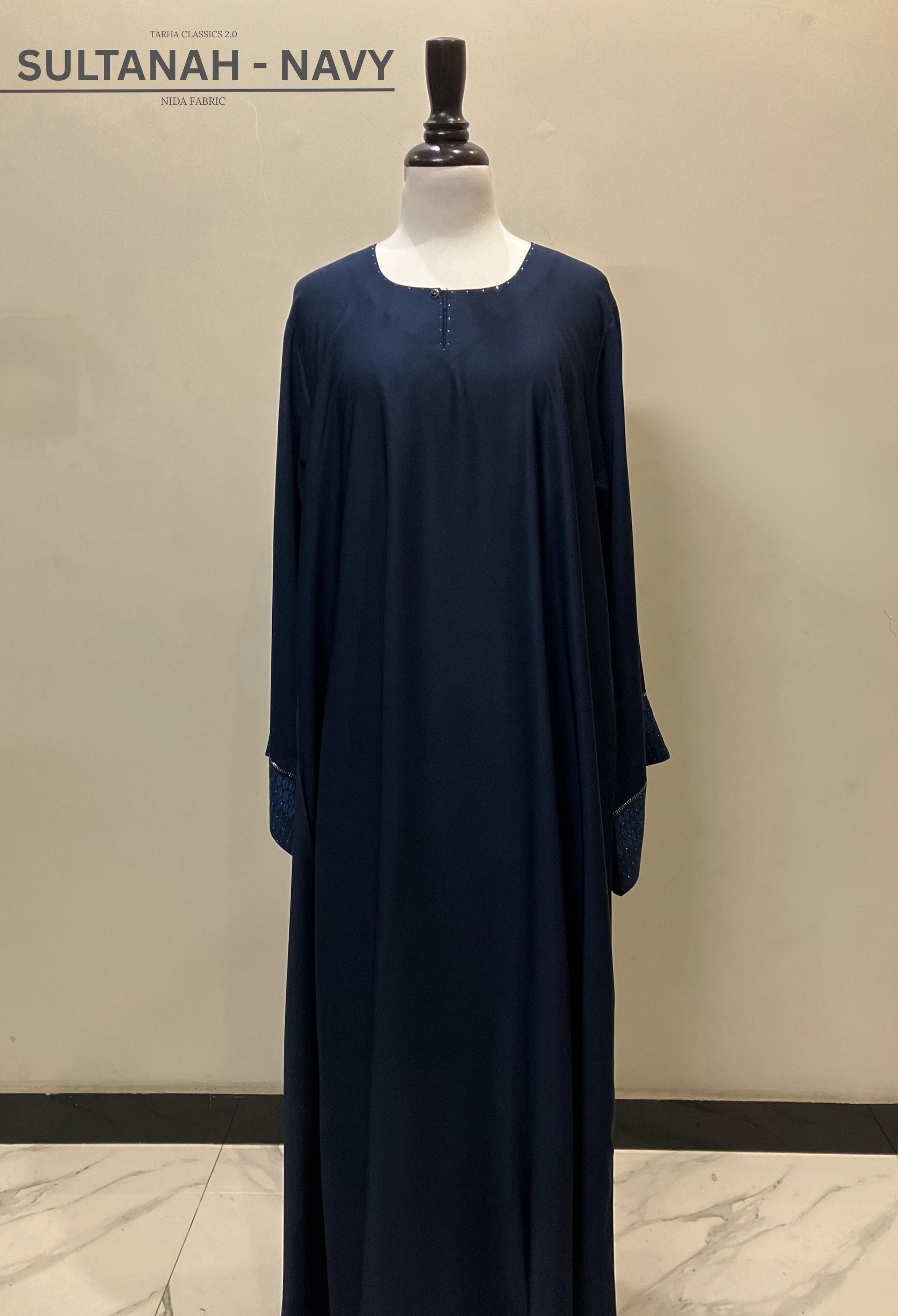 Sultanah navy blue closed abaya in premium Nida fabric featuring a clean front and sophisticated silhouette – Tarha.pk Classics V2.
