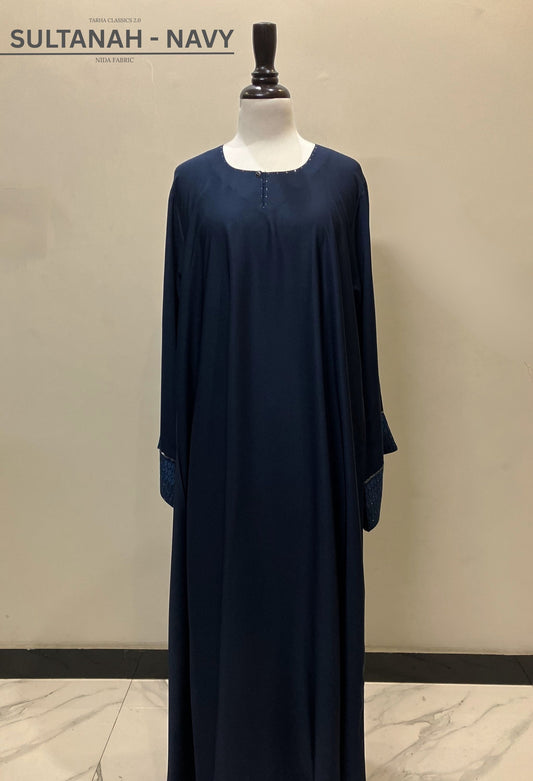Sultanah navy blue closed abaya in premium Nida fabric featuring a clean front and sophisticated silhouette – Tarha.pk Classics V2.
